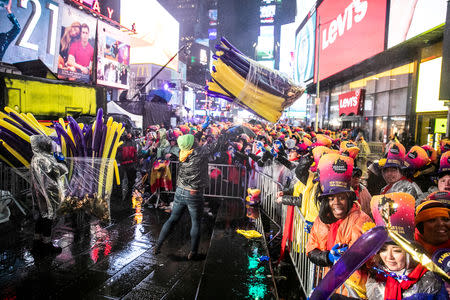 Revelers celebrate New Year's Eve in Times Square in the Manhattan borough of New York, U.S., December 31, 2018. REUTERS/Jeenah Moon