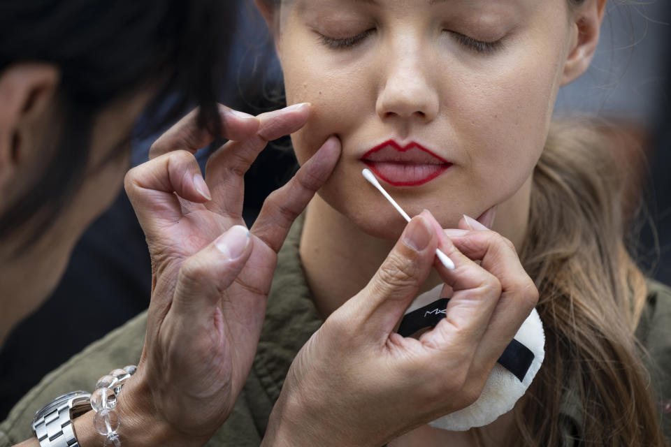 A model prepares backstage for the Prabal Gurung runway show during Fashion Week, Sunday, Sept. 8, 2019 in New York. (AP Photo/Craig Ruttle)