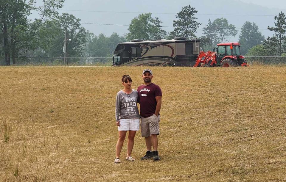 Kurt and Bonnie Stebbins stand on the track at McKean County Raceway before starting renovations. The Wellsville couple debuted as promoters of the track Thursday night.