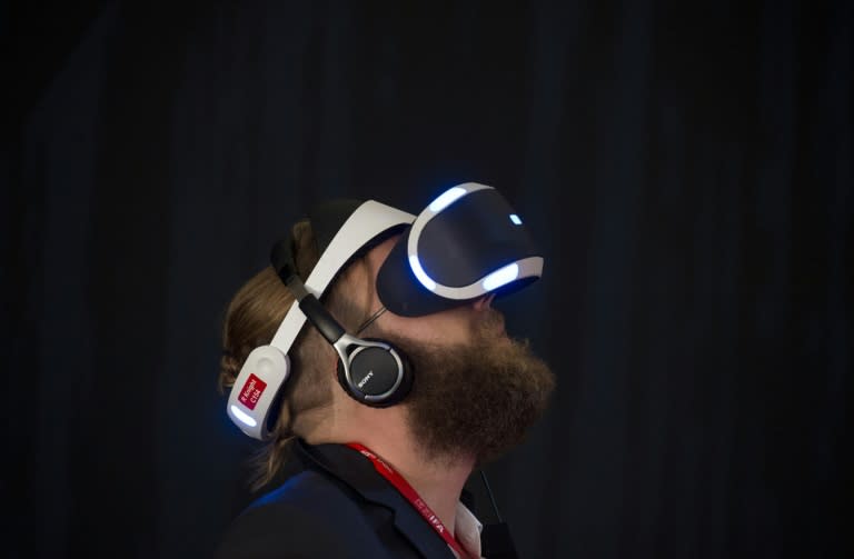 A visitor tries Sony's Project Morpheus virtual reality headset for PlayStation 4 ahead of the opening of the 55th IFA (Internationale Funkausstellung), on September 2, 2015 in Berlin
