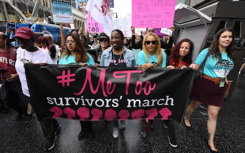 Women who are survivors of sexual harassment, sexual assault, sexual abuse and their supporters protest during a #MeToo march in Hollywood, California on November 12, 2017 - Credit: MARK RALSTON /AFP