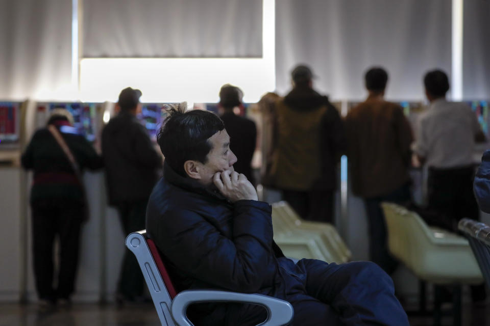 Chinese investors monitor stock prices at a brokerage house in Beijing, Thursday, Nov. 28, 2019. Asian shares were mostly lower on Thursday after President Donald Trump signed a bill expressing support for human rights in Hong Kong. (AP Photo/Andy Wong)