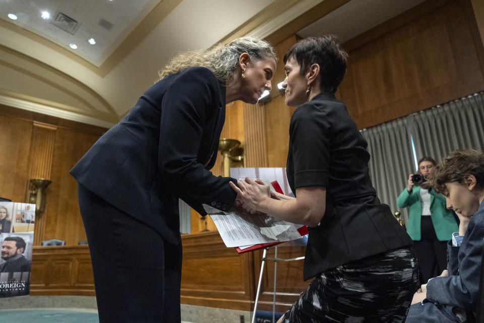 Sonata Coulter, State Dept. Deputy Assistant Secretary, Bureau of European and Eurasian Affairs, left, greets Evgenia Kara-Murza, human rights advocate and wife of Vladimir Kara-Murza, right, after speaking about Kara-Murza, during an event calling for the immediate release of the a Russian opposition leader and journalist imprisoned by the Russian government, Tuesday, April 9, 2024, on Capitol Hill in Washington. (AP Photo/Jacquelyn Martin)