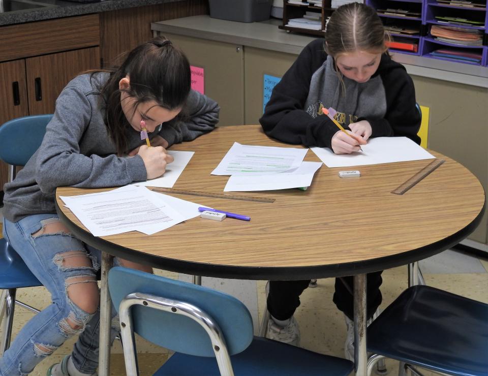 Seventh-graders Neveah Stevens and Peyton Vickers of River View Junior High School work on zentangles, an art design using words, dots, lines and curves. The piece was to draw inspiration from the life and "I Have a Dream" speech of Martin Luther King Jr., coinciding with the annual holiday in his honor.