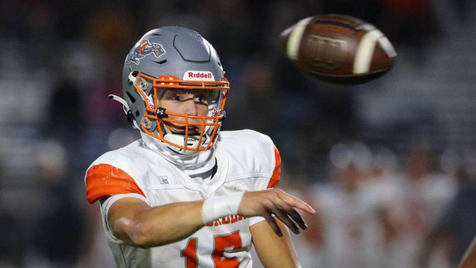 Kane Cooks makes a side-arm pass under pressure from Dane Adler. Atascadero beat San Luis Obispo 21-20 in an Ocean League football game in SLO on Sept. 22, 2023.