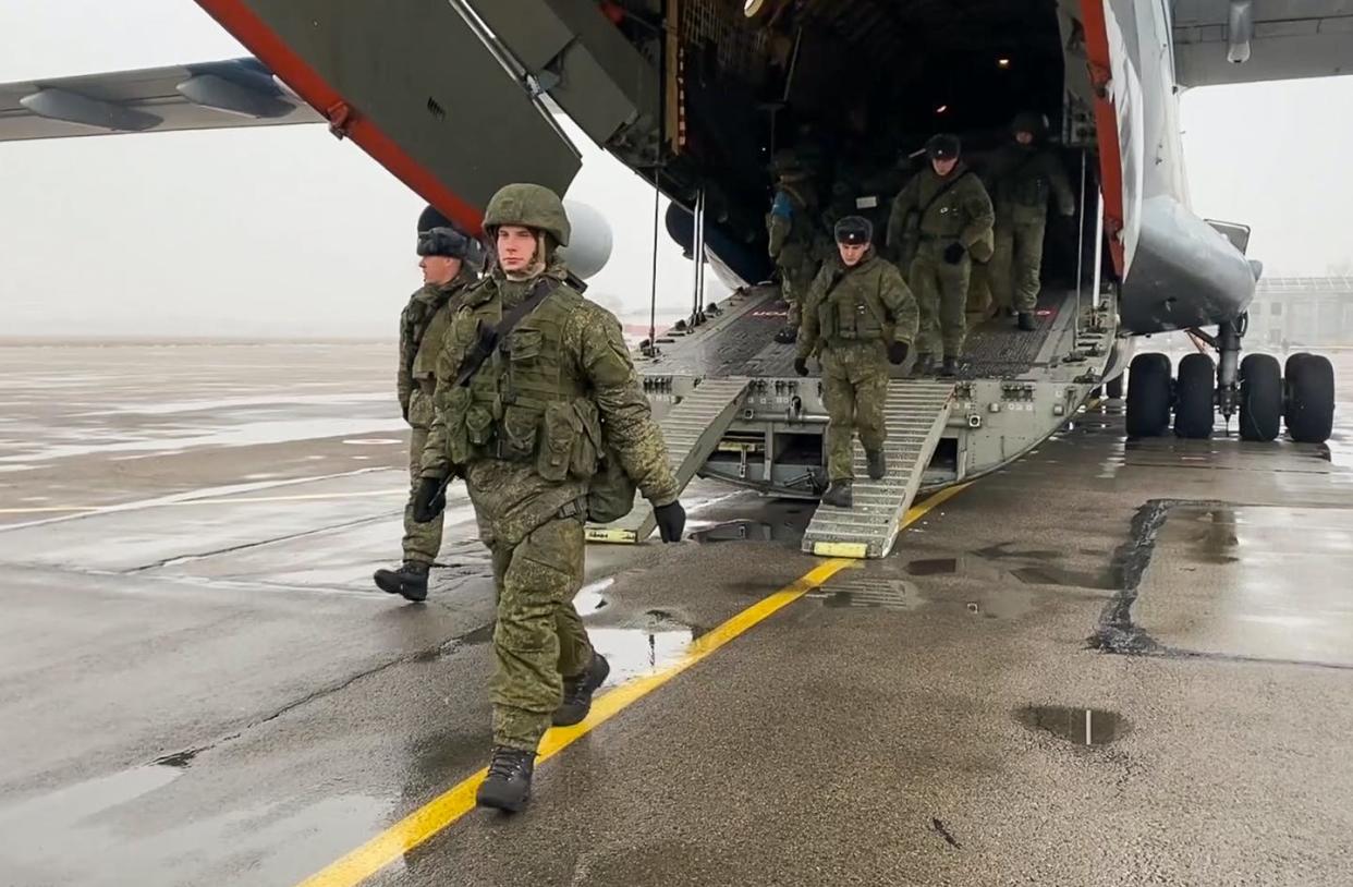 <span class="caption">A Russian military photo shows Russian soldiers arriving in Kazakhstan on Jan. 7, 2022.</span> <span class="attribution"><a class="link " href="https://www.gettyimages.com/detail/news-photo/pictured-in-this-video-screen-grab-are-russian-csto-news-photo/1237581988" rel="nofollow noopener" target="_blank" data-ylk="slk:Russian Defence Ministry\TASS via Getty Images;elm:context_link;itc:0;sec:content-canvas">Russian Defence Ministry\TASS via Getty Images</a></span>
