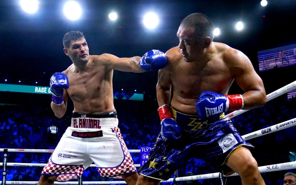 Filip Hrgovic (left) in action against Zhang Zhilei during their Final Eliminator for the IBF Heavyweight World Title - PA