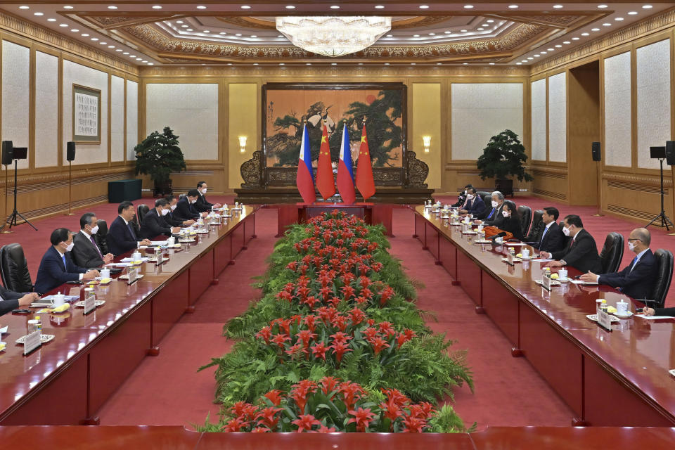 In this photo released by Xinhua News Agency, Chinese President Xi Jinping, third from left, talks to visiting Philippine President Ferdinand Marcos Jr., third from right, during a bilateral meeting at the Great Hall of the People in Beijing, Wednesday, Jan. 4, 2023. Philippine President Ferdinand Marcos Jr. is pushing for closer economic ties on a visit to China that seeks to sidestep territorial disputes in the South China Sea. (Yue Yuewei/Xinhua via AP)