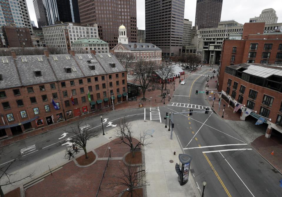 FILE - In this April 19, 2013 file photo, the streets and sidewalks around Faneuil Hall Marketplace in Boston are almost deserted at dinnertime as a call for "shelter-in-place" for Boston and some area communities remains in force. Massachusetts Gov. Deval Patrick says the decision to lock down much of greater Boston during the search for the surviving suspect in the Boston Marathon bombings was a “tough call” but one he’s glad that was made. (AP Photo/Elise Amendola, File)