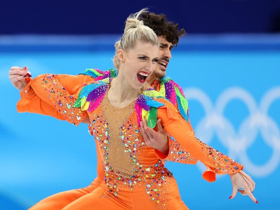 Piper Gilles and Paul Poirier of Team Canada skate during the rhythm dance on Saturday at Capital Indoor Stadium at the Beijing 2022 Olympic Winter Games. They sit in sixth place heading into the free dance. (Elsa/Getty Images - image credit)