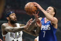 New Orleans Pelicans forward Brandon Ingram, left, knocks the ball from the hands of Los Angeles Clippers guard Amir Coffey during the first half of an NBA basketball game Monday, Nov. 29, 2021, in Los Angeles. (AP Photo/Mark J. Terrill)