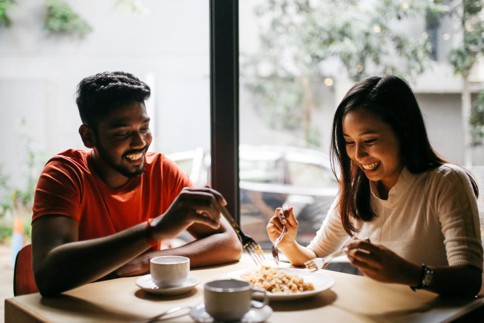 Young couple having a meal together.