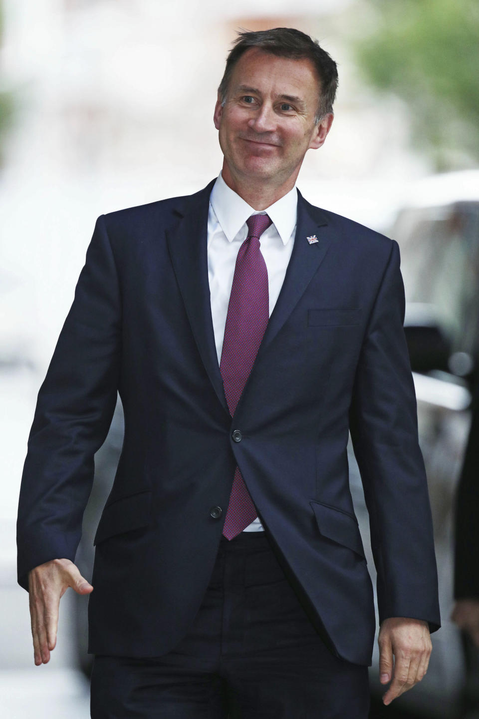 Conservative Party leadership contender Jeremy Hunt arrives for a live TV debate with other contenders Tuesday June 18, 2019. Britain's Conservative Party will continue to hold elimination votes until the final two contenders will be put to a vote of party members nationwide, with the winner due to replace Prime Minister Theresa May as party leader and prime minister. (Yui Mok/PA via AP)