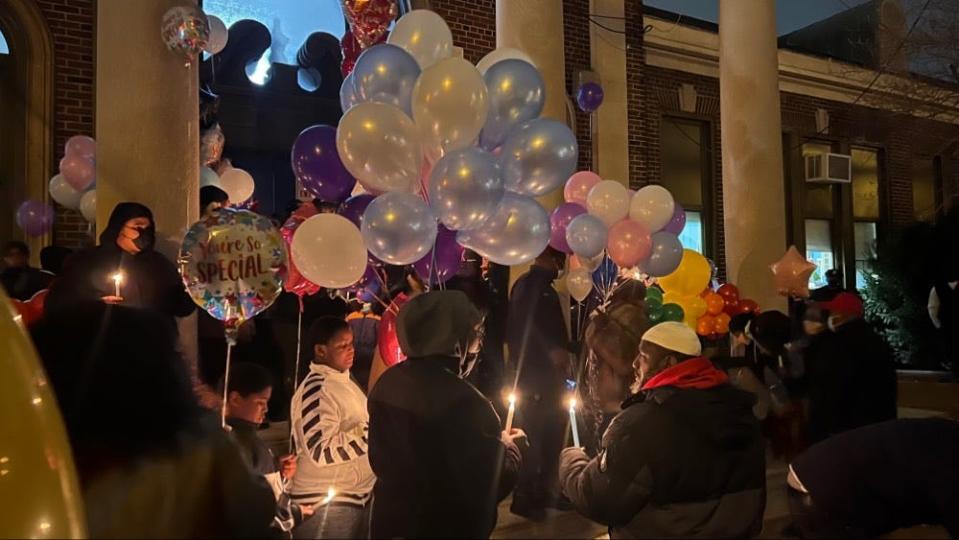 Friends, family and community members gather Thursday night in the Fairmount section of Philadelphia to remember the 12 people killed in a rowhome fire on Wednesday.