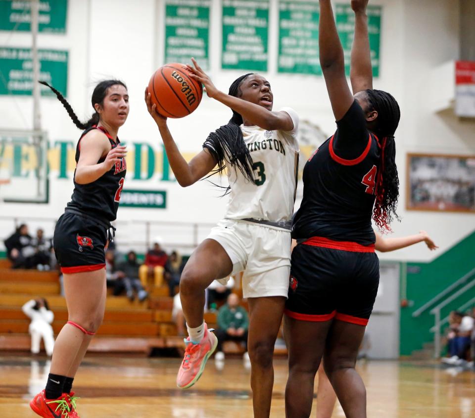 South Bend Washington junior Ryiah Wilson (3) looks to put a shot up over Bolingbrook senior Jasmine Jones during a girls basketball game Saturday, Jan. 6, 2024, at Washington High School.