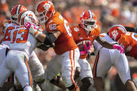 Clemson running back Travis Etienne (9) runs the ball in for a 25 yard touchdown during an NCAA college football game against Syracuse in Clemson, S.C., on Saturday, Oct. 24, 2020. (Ken Ruinard/Pool Photo via AP)