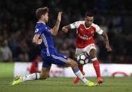 Britain Football Soccer - Arsenal v Chelsea - Premier League - Emirates Stadium - 24/9/16 Arsenal's Theo Walcott in action with Chelsea's Marcos Alonso Reuters / Dylan Martinez Livepic