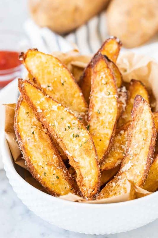 <p>Plated Cravings</p><p>Tossed with Parmesan these easy homemade air-fried wedges make a tasty appetizer or side dish.</p><p><strong>Get the recipe: <a href="https://platedcravings.com/air-fryer-potato-wedges/" rel="nofollow noopener" target="_blank" data-ylk="slk:Air Fryer Potato Wedges;elm:context_link;itc:0;sec:content-canvas" class="link ">Air Fryer Potato Wedges</a></strong></p>