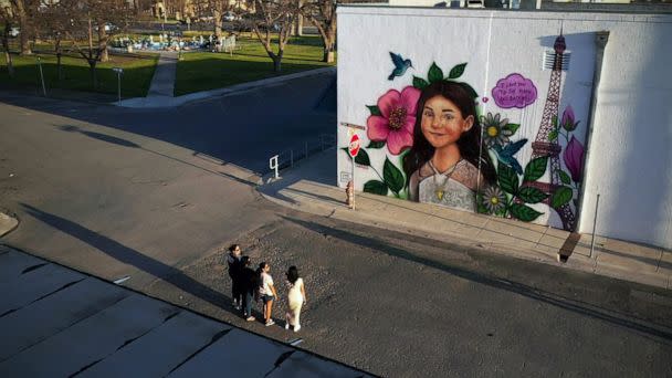 PHOTO: Mothers of children killed during the Robb Elementary School mass shooting visit a mural depicting Jackie Cazares on March 5, 2023. Artworks around Uvalde, Texas, honor all 21 victims. (ABC News)