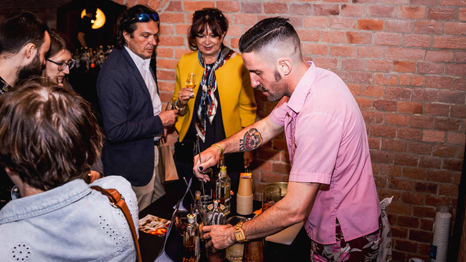 Matt Levy mixing up drinks during a Covert Cocktail Club event