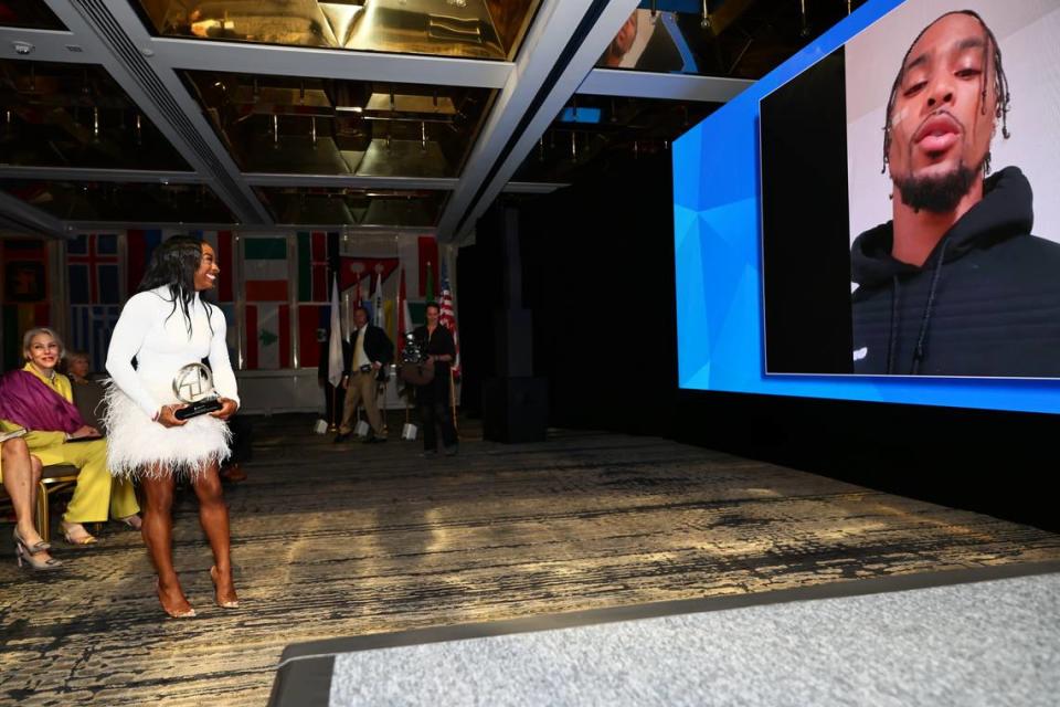 Olympic athlete Simone Biles is surprised by a video message from her husband NFL star Jonathan Owens after recieving an award for her mental health advocacy during the 17th annual Gobal Wellness Summit on Nov. 7, 2023 in Miami, Florida.