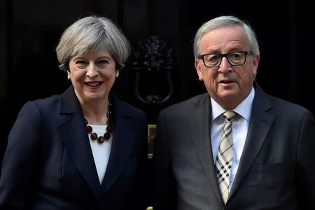 Britain's Prime Minister Theresa May welcomes Head of the European Commission, President Jean-Claude Juncker to Downing Street in London, Britain April 26, 2017. REUTERS/Hannah McKay