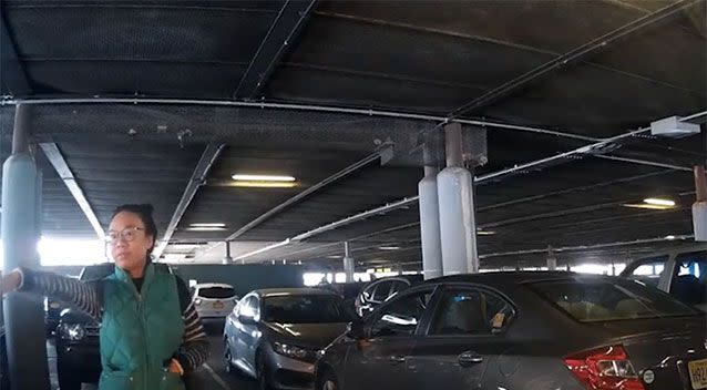 The woman points out other available spaces. Source: YouTube