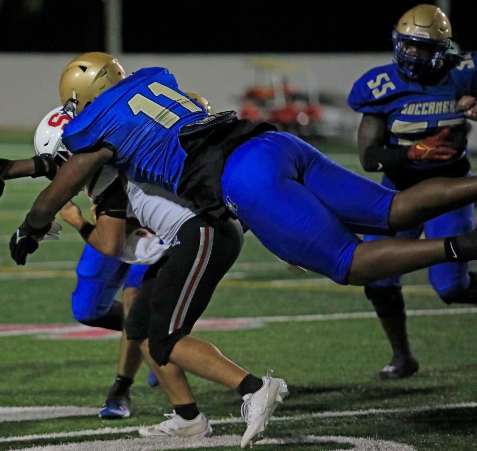 Mainland’s LJ McCray (11) sacks Satellite quarterback Ethan Rafaele during the first round of the Class 3S playoffs. McCray, a five-star defensive lineman committed to Florida, faces St. Augustine Thursday.