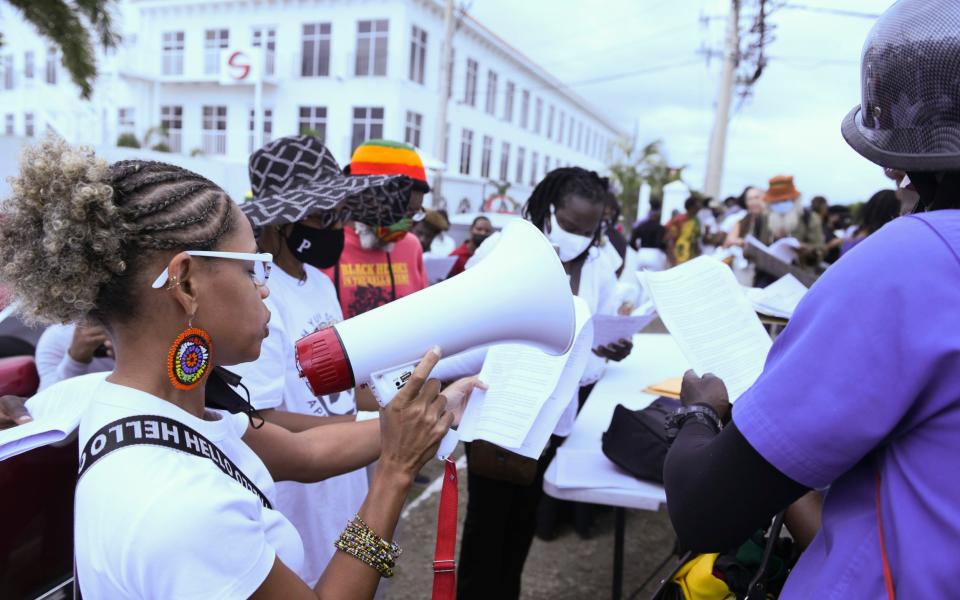 The arrival of the Duke and Duchess of Cambridge in Kingston was met with protests outside the British High Commission - RICARDO MAKYN/AFP