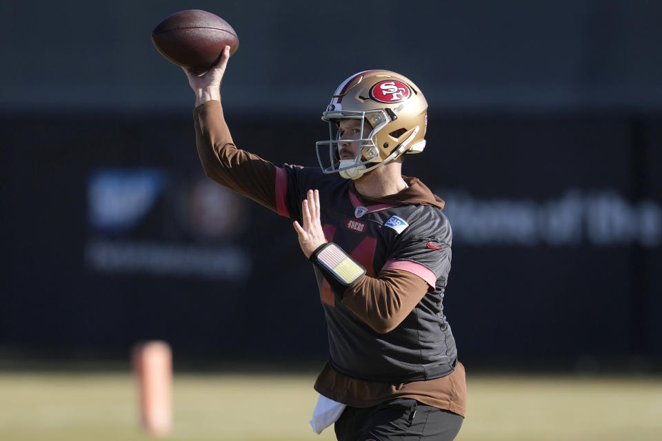San Francisco 49ers quarterback Sam Darnold passes during an NFL football practice in Santa Clara, Calif., Thursday, Jan. 25, 2024. The 49ers are scheduled to play the Detroit Lions, Sunday in the NFC championship game. (AP Photo/Jeff Chiu)