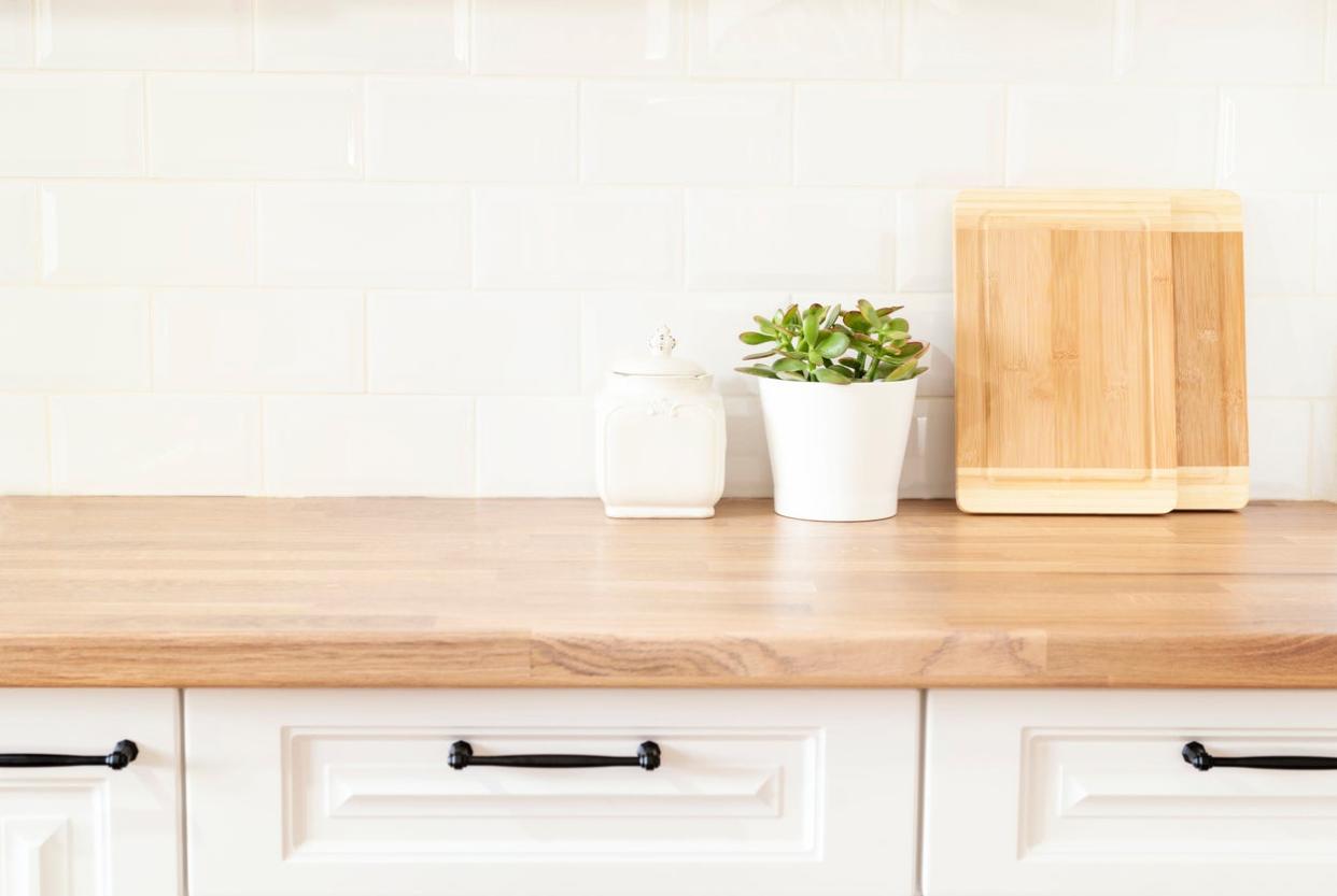 Butcher Block Countertop and White Cabinets