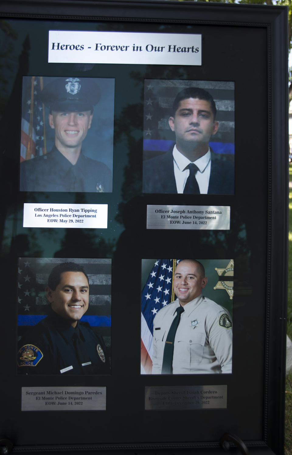 Photos of the fallen officers are displayed at the Peace Officers’ Memorial at the Paso Robles Downtown City Park on Wednesday, May 17, 2023.