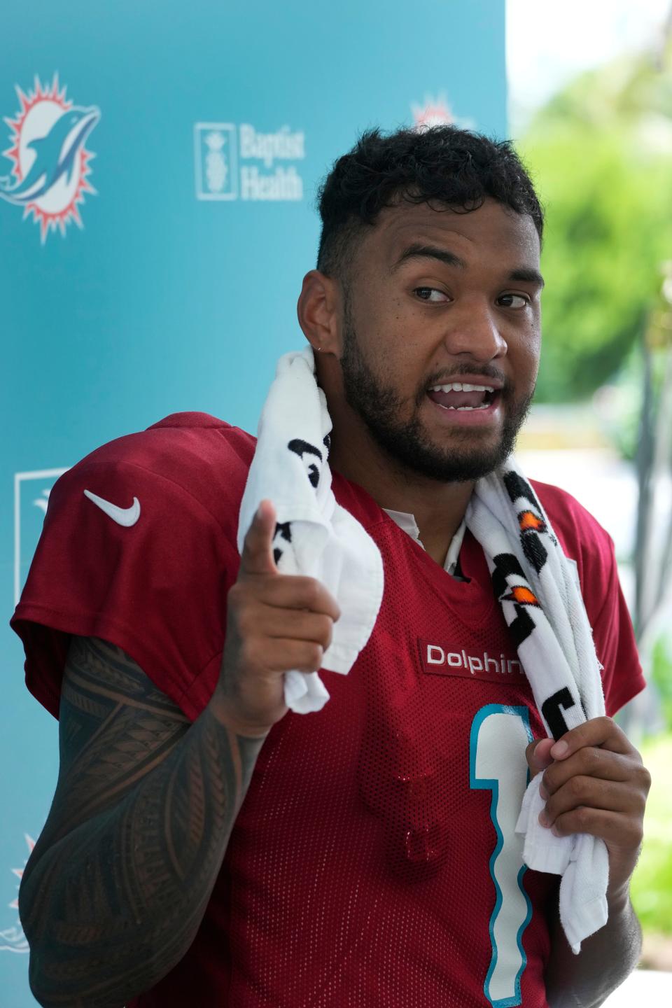 Miami Dolphins quarterback Tua Tagovailoa answers questions during a news conference after a joint practice with the Atlanta Falcons at the NFL football team's training facility, Wednesday, Aug. 9, 2023, in Miami Gardens, Fla.