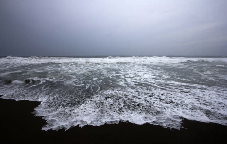 Waves break on the beach in Boca de Pascuales, Colima State, Mexico, on October 22, 2015