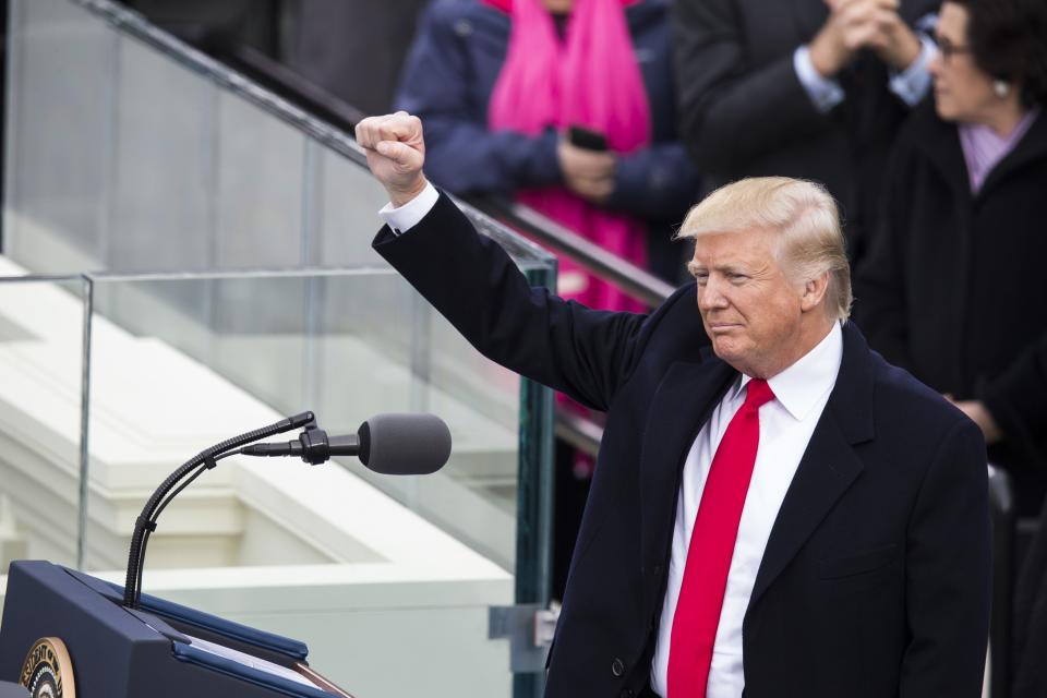 President Donald Trump raises his fist to the crowds during the 58th U.S. Presidential Inauguration after he was sworn in as the 45th President of the United States of America on January 20, 2017.