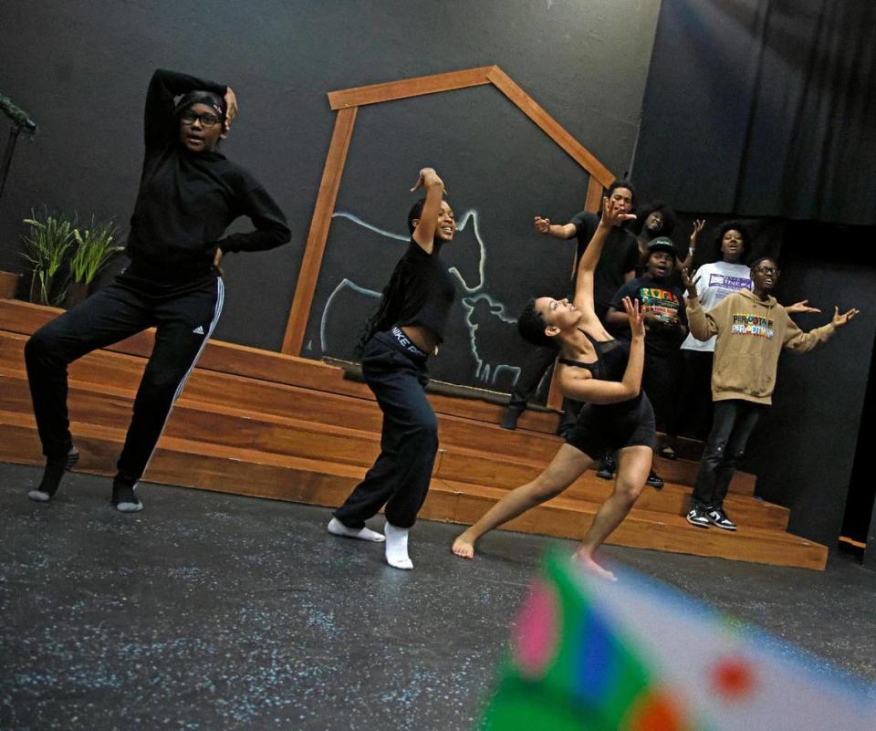 Actors and dancers perform during rehearsal for “Bone Soup: A Kwanza Story” at the Jubilee Theatre that is supported by the Maroon 9 Community Enrichment Organization, an organization that provides after school enrichment youth programs.