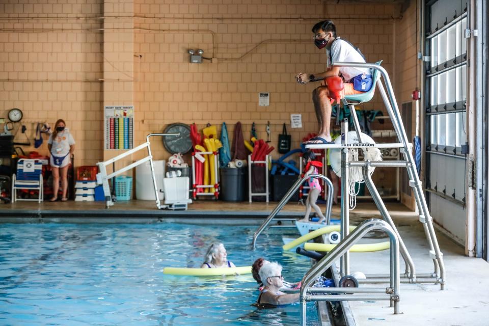 Lifeguard Logan Wong watches over swimmers Monday, June 14, 2021, at Thatcher Park's swimming pool in Indianapolis.