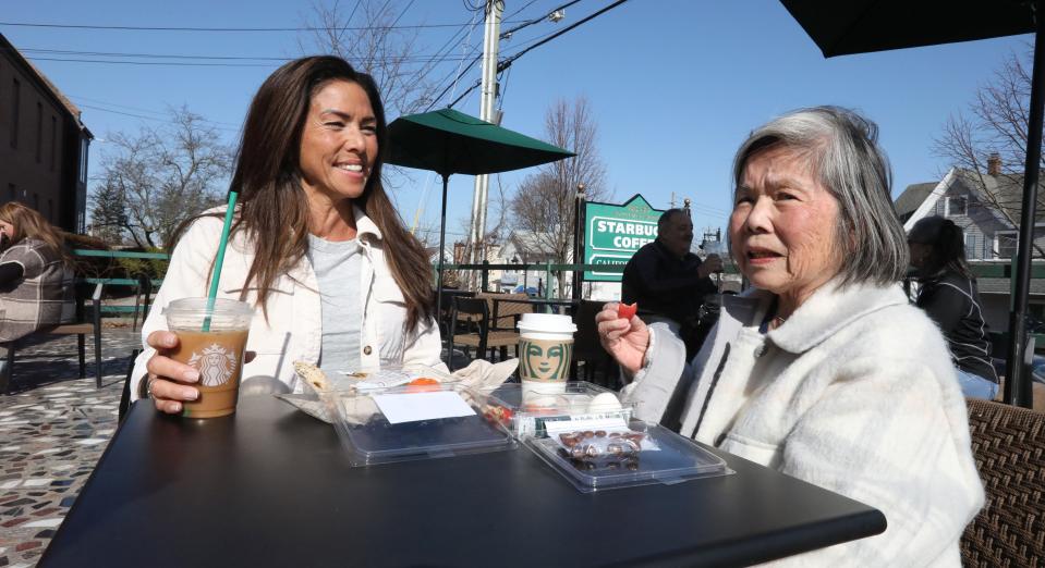 Kim Lauro and Emiko Sortino enjoy lunch on a warm, sunny table at Starbucks in New City on Feb. 15, 2023.