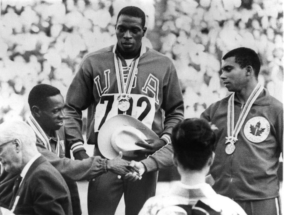 <p>Robert Hayes of the U.S.A. (center) wins gold for the Men's 100 Meters final. Enrique Figuerola of Cuba (left) wins silver and congratulates Harry Jerome of Canada (right), who wins bronze.</p>