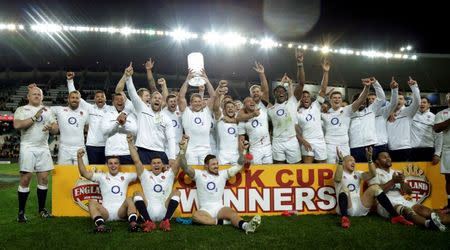 Rugby Union - Rugby Test - England v Australia's Wallabies - Sydney, Australia - 25/06/16. England Captain Dylan Hartley holds aloft the Australia - England test series trophy after winning their third game against Australia. REUTERS/Jason Reed