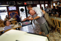 <p>President Barack Obama is picked up and lifted off the ground by Scott Van Duzer, owner of Big Apple Pizza and Pasta Italian Restaurant, during an unannounced stop, Sunday, Sept. 9, 2012, in Ft. Pierce, Fla. (AP Photo/Pablo Martinez Monsivais) </p>