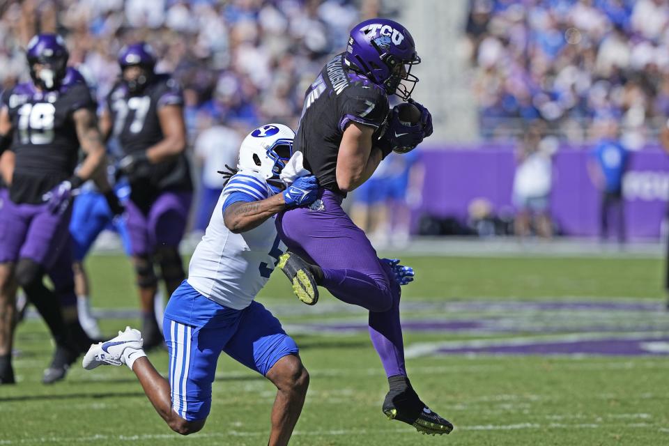 TCU wide receiver JP Richardson (7) catches a touchdown pass against BYU cornerback Eddie Heckard (5) during the first half of an NCAA college football game Saturday, Oct. 14, 2023, in Fort Worth, Texas. | LM Otero, Associated Press