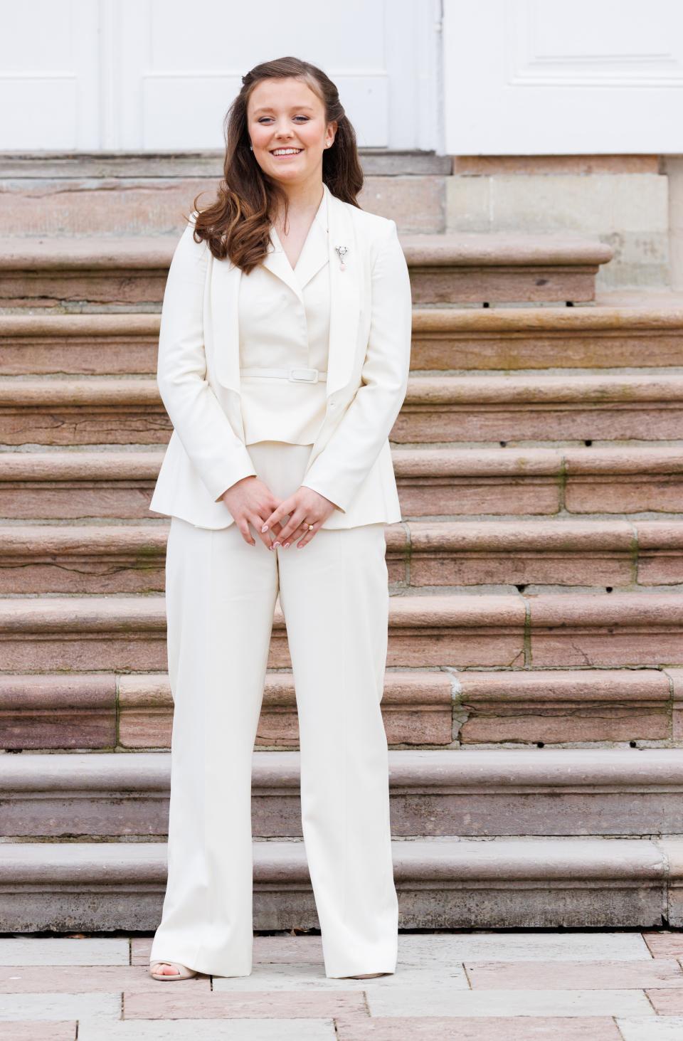 Princess Isabella of Denmark wearing a white pantsuit