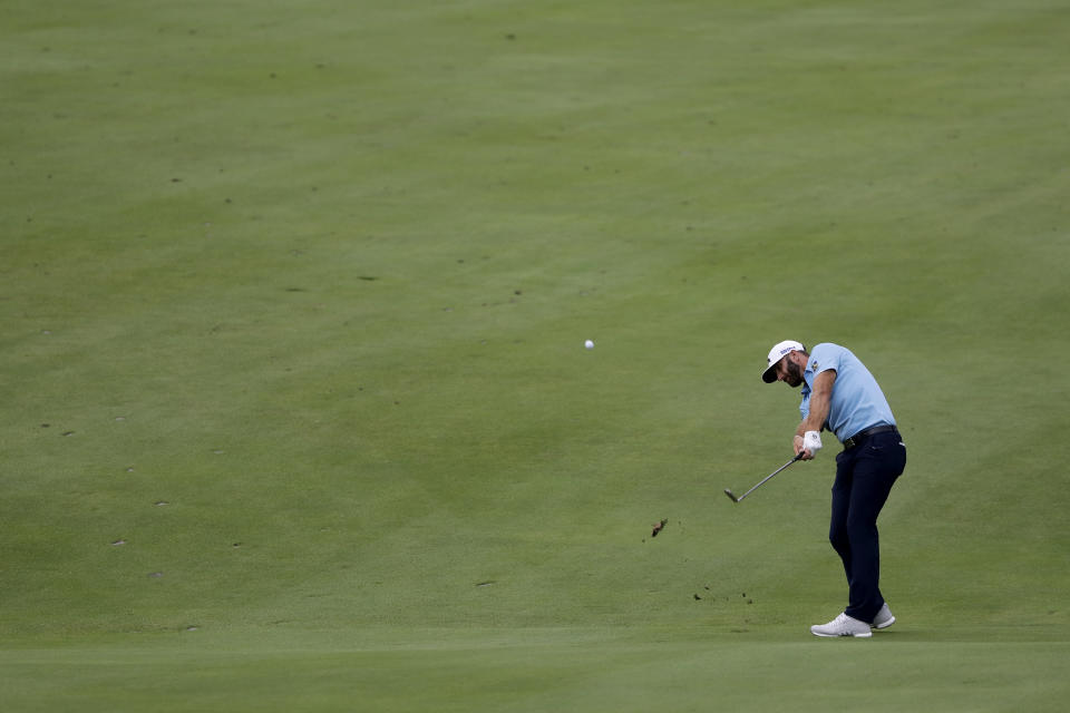 Dustin Johnson hits a shot from the 18th fairway during the final round of the Travelers Championship golf tournament at TPC River Highlands, Sunday, June 28, 2020, in Cromwell, Conn. (AP Photo/Frank Franklin II)