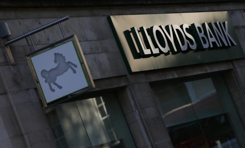 Signs are seen outside a branch of Lloyds Bank in central London October 28, 2014. . REUTERS/Andrew Winning