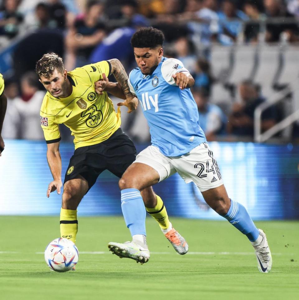 Chelsea FC forward Christian Pulisic, left, and Charlotte FC defender Jaylin Lindsey battle for the ball at the Bank of America Stadium in Charlotte, N.C., on Wednesday, July 20, 2022.
