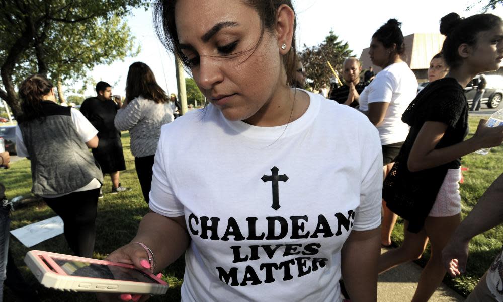 Astevana Shaya, 28, of Sterling Heights, Michigan, wears a Chaldeans Lives Matter T-shirt at a protest on 12 June. The arrests of dozens of Iraqi Christians in southeastern Michigan by US immigration officials appear to be among the first roundups of people from Iraq who have long faced deportation.