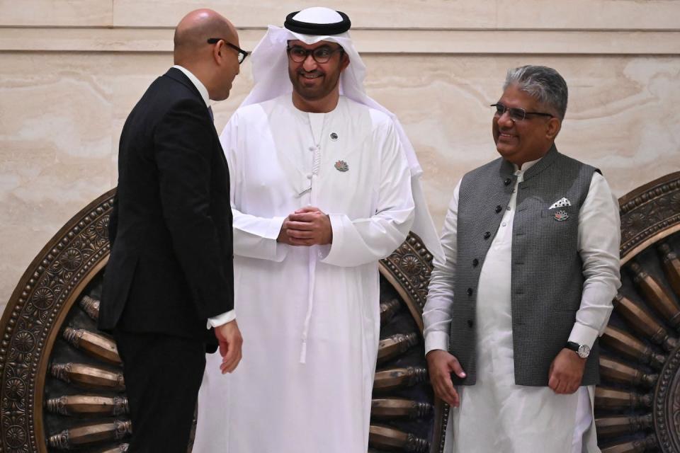 Sultan Ahmed al-Jaber has met with officials in several developing countries, including India’s minister for environment, forest and climate change, Bhupender Yadav, right. <a href="https://www.gettyimages.com/detail/news-photo/bhupender-yadav-indias-minister-for-environment-forest-and-news-photo/1559090143" rel="nofollow noopener" target="_blank" data-ylk="slk:R.Satish Babu/AFP via Getty Images;elm:context_link;itc:0;sec:content-canvas" class="link ">R.Satish Babu/AFP via Getty Images</a>