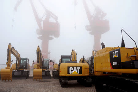 Caterpillar machines are seen at Lianyungang port in Jiangsu province, China January 21, 2018. REUTERS/Stringer/Files