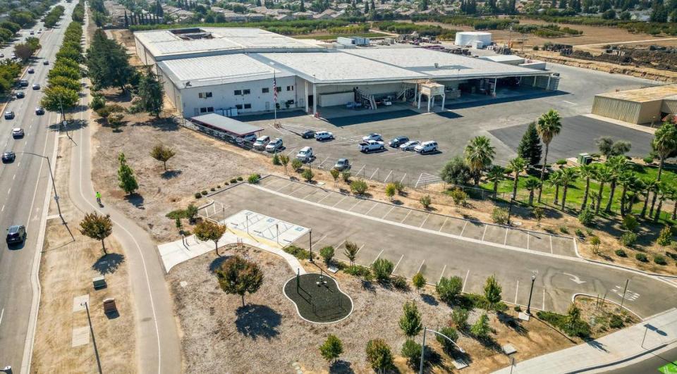 The packing plant at P-R Farms is shown in the at the southwest corner of Shepherd and Willow avenues with parking stalls and the start of the Clovis Old Town Trail in the foreground of this drone image made on Tuesday, Oct. 17, 2023. Food trucks that had operated at the old Enzo’s Table location at the southeast corner of the intersection will move to this corner.